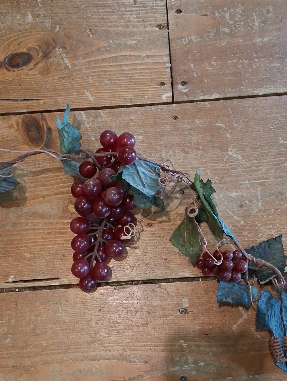 Botanical‎ grape leaf and fruit garland featuring faux clusters of grapes